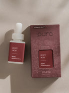 Pura Juicy Acai fragrance refill bottle and packaging on a beige background
