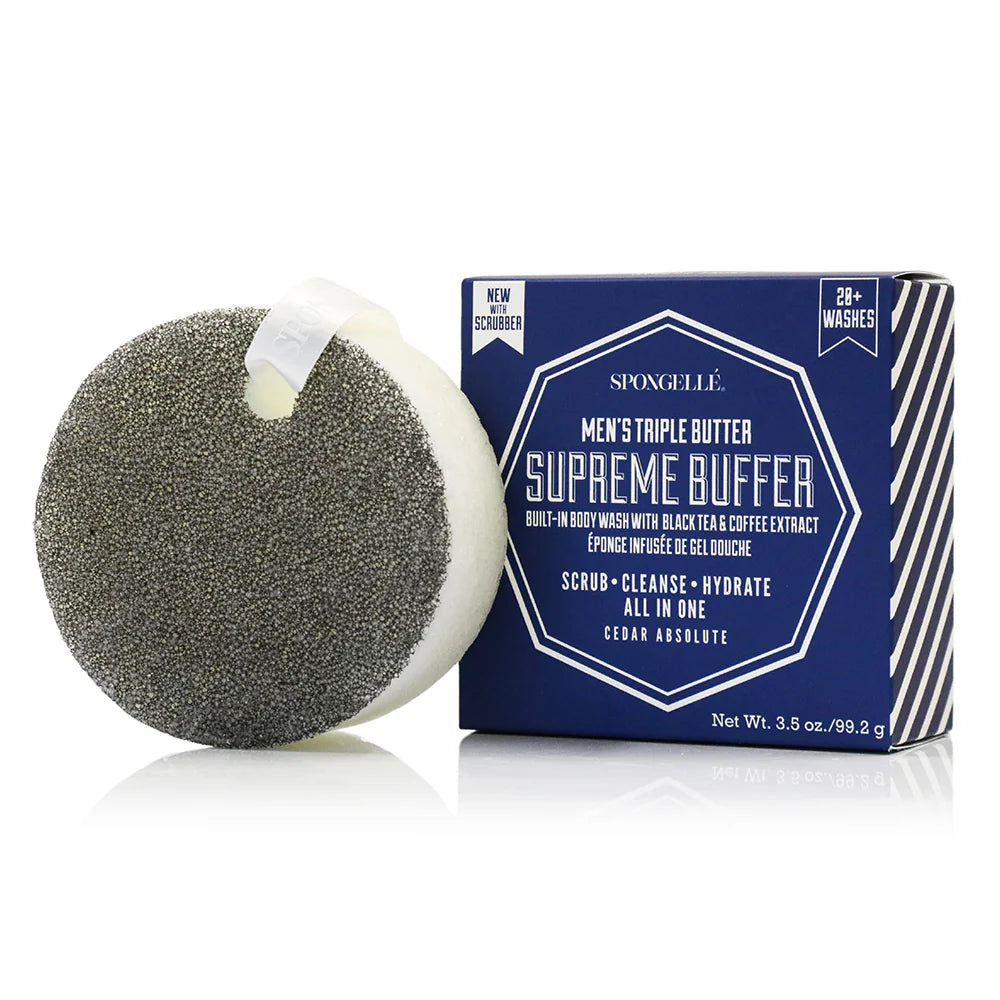 A sponge body wash scrubber with a gray textured circular pad and white hanging loop, shown next to its navy blue retail box labeled 'Spongellé Men's Triple Butter Supreme Buffer'.