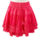 Red ruffled skirt on a mannequin against a white background